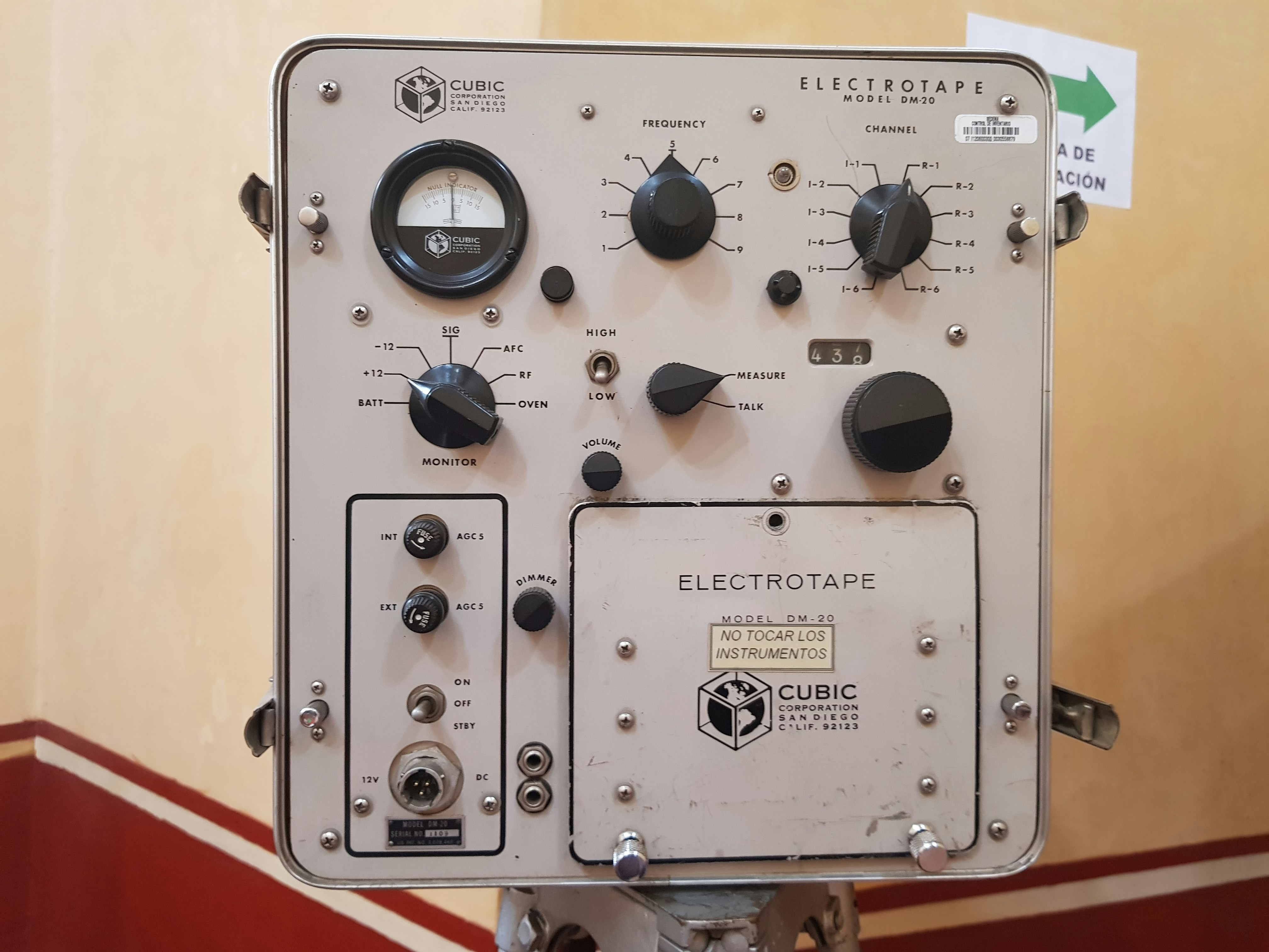 An old electronics instrument panel with various knobs and dials.